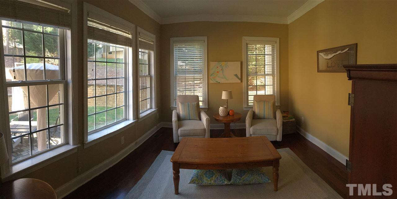 8114 Dreamy Way Raleigh, NC 27613 - Photo 12 of 22 a outdoor room with chairs and a window