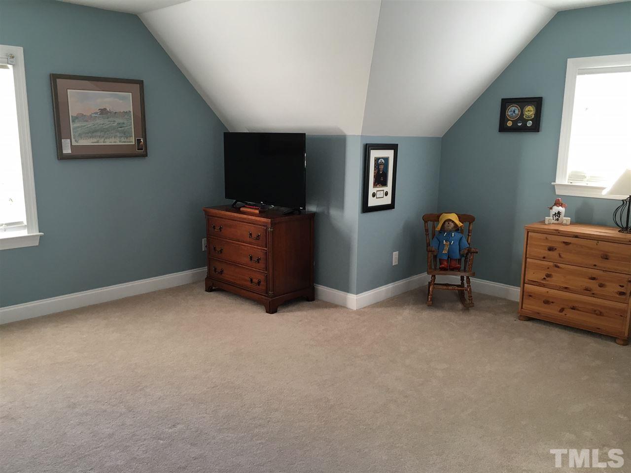 8114 Dreamy Way Raleigh, NC 27613 - Photo 17 of 22 a view of room with furniture and a window