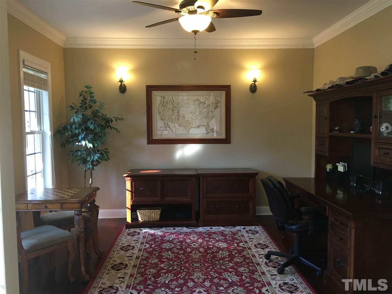 8114 Dreamy Way Raleigh, NC 27613 - Photo 4 of 22 a living room with furniture and a rug
