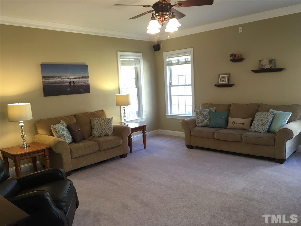 8114 Dreamy Way Raleigh, NC 27613 - Photo 10 of 22 a living room with furniture and a window