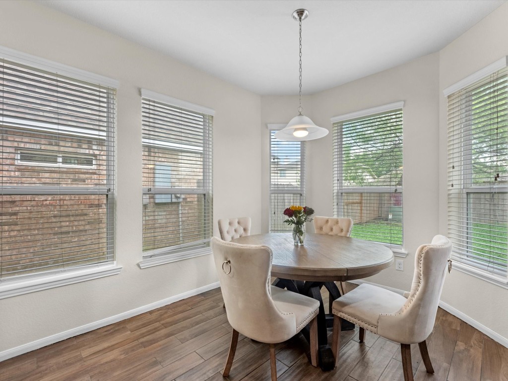 21554 Rainfall Park Drive Spring, TX 77388 - Photo 12 of 36 A bright dining area conveniently located off the kitchen. The space offers a cozy and inviting atmosphere, perfect for meals with a view of the backyard.