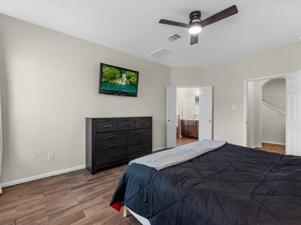 21554 Rainfall Park Drive Spring, TX 77388 - Photo 16 of 36 Primary bedroom with ensuite full bathroom through double doors.