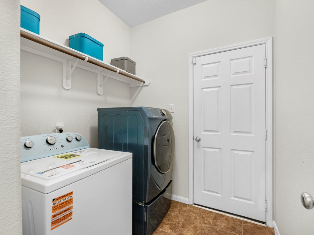 21554 Rainfall Park Drive Spring, TX 77388 - Photo 30 of 36 Laundry room located inside the home featuring a shelf for added storage.