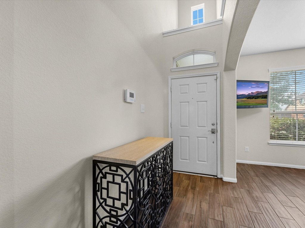 21554 Rainfall Park Drive Spring, TX 77388 - Photo 4 of 36 You are greeted in the entryway with high ceilings and ample natural light throughout the front entry of the home.