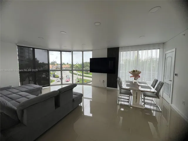 a view of a utility room with wooden walls and furniture