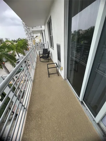 a view of a swimming pool with a table and chairs