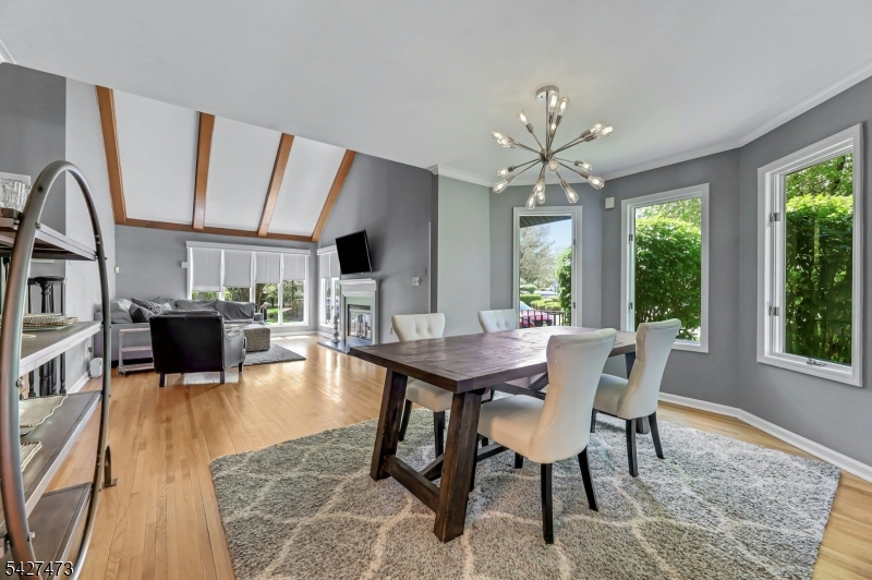 100 Easedale Road, Unit 100 Wayne, NJ 07470 - Photo 13 of 43 a view of a dining room with furniture window and wooden floor