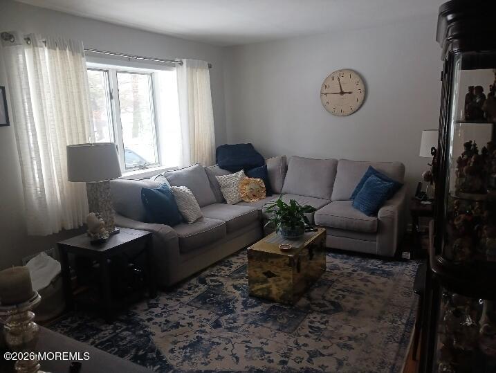 115 Pension Road Manalapan, NJ 07726 - Photo 15 of 19 a living room with furniture rug and window