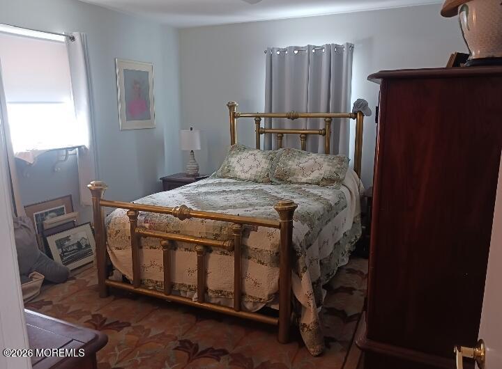 115 Pension Road Manalapan, NJ 07726 - Photo 17 of 19 a bedroom with a bed and wooden floor