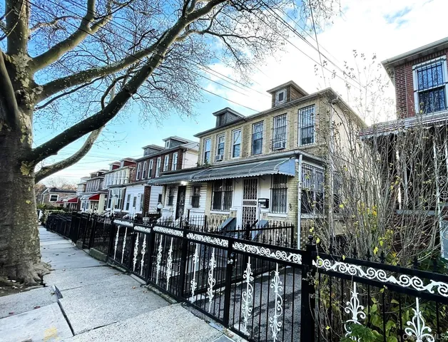 front view of a house with a small yard