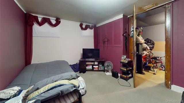 a bedroom with bed and a dresser