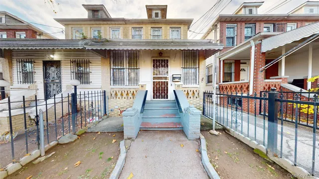 a view of a brick building with many windows