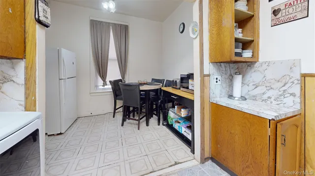 a view of kitchen and dining room with windows