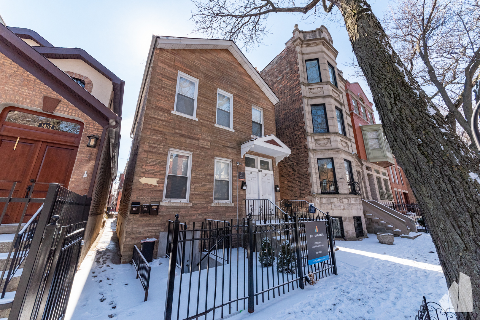 1431 West Flournoy Street, Unit 2F Chicago, IL 60607 - Photo 1 of 1 a view of a brick building with many windows