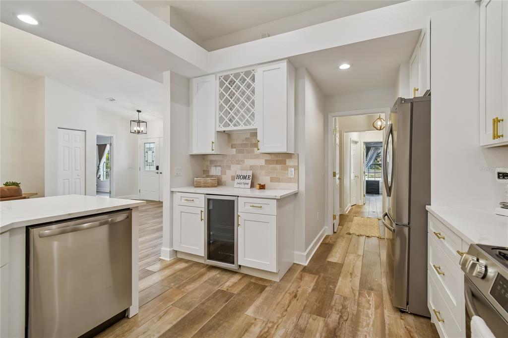 2513 North Valrico Road Seffner, FL 33584 - Photo 11 of 76 a kitchen with white cabinets and appliances