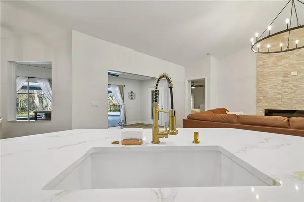 a kitchen with a refrigerator stove and sink