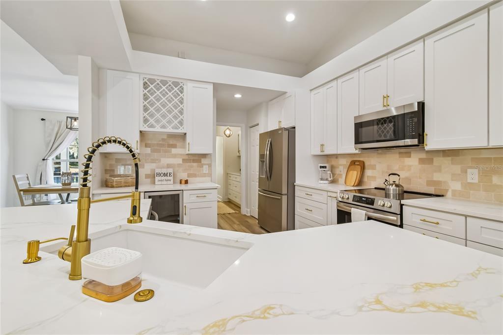 2513 North Valrico Road Seffner, FL 33584 - Photo 13 of 76 a kitchen with granite countertop a sink appliances and cabinets