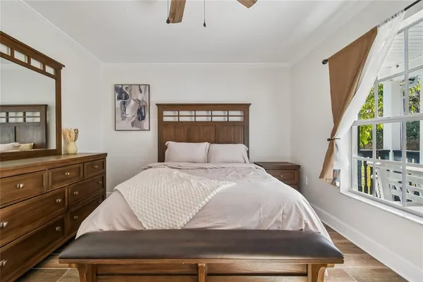 a bathroom with a toilet a sink a mirror and vanity