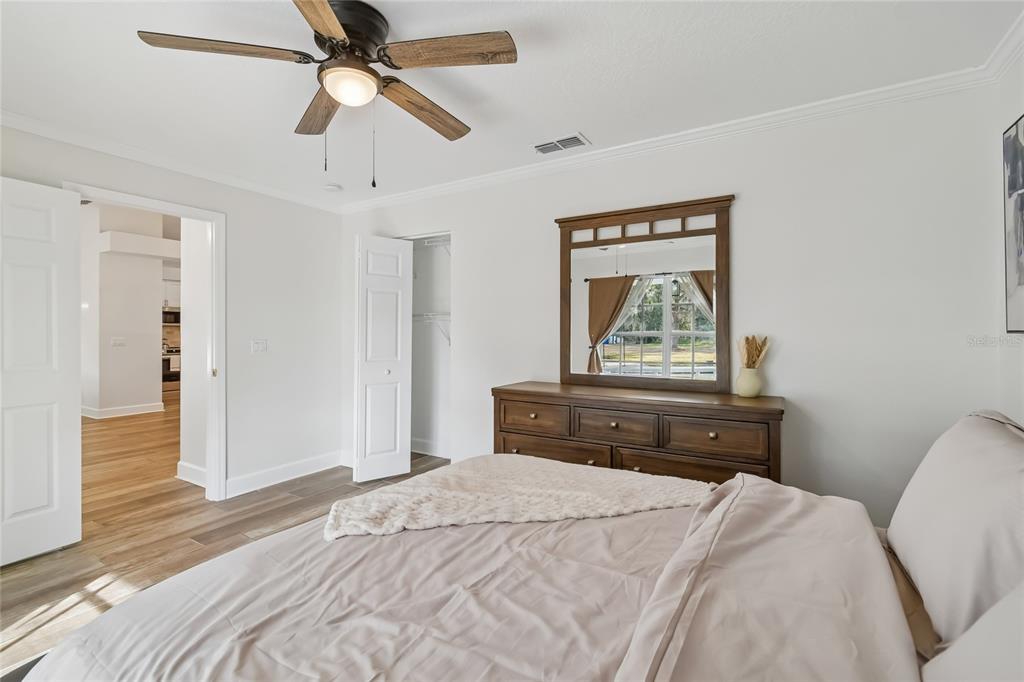 2513 North Valrico Road Seffner, FL 33584 - Photo 38 of 76 a bedroom with a bed and a chandelier