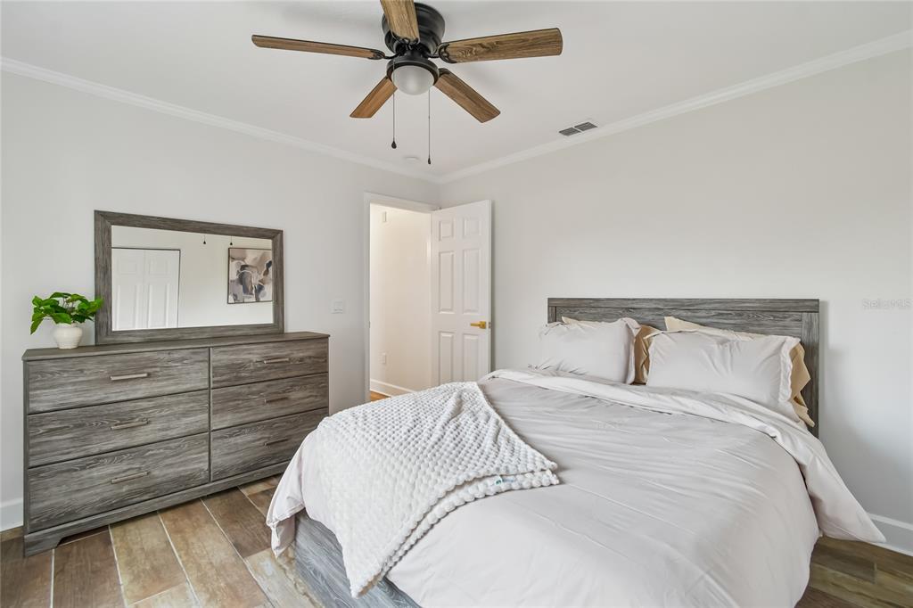 2513 North Valrico Road Seffner, FL 33584 - Photo 41 of 76 a bedroom with a bed and a chandelier