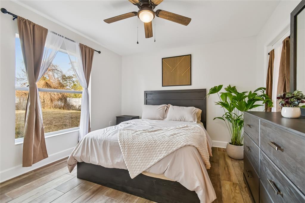 2513 North Valrico Road Seffner, FL 33584 - Photo 43 of 76 a bedroom with a bed potted plant with the window