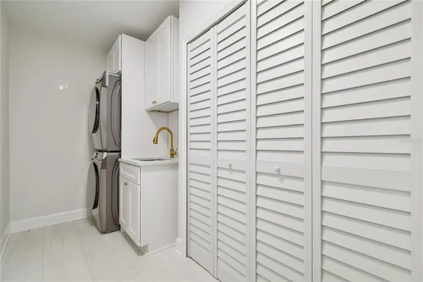 a view of a house with a backyard and a tree