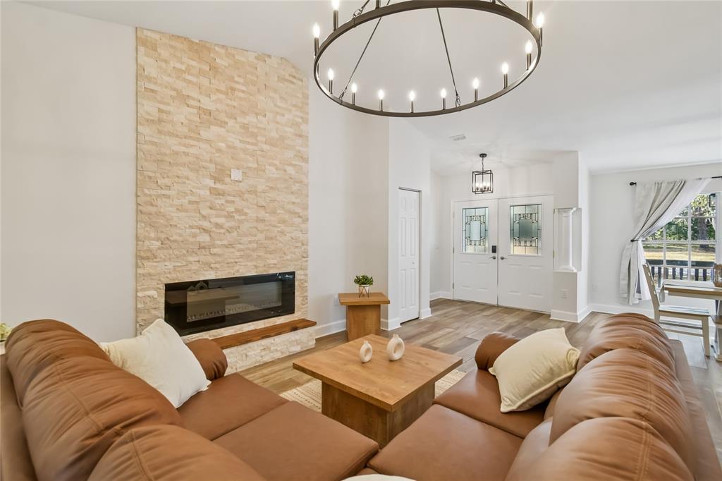 2513 North Valrico Road Seffner, FL 33584 - Photo 6 of 76 a living room with furniture and a fireplace