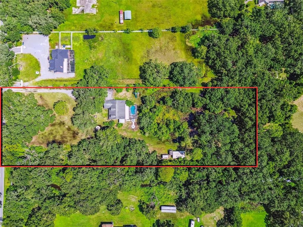 2513 North Valrico Road Seffner, FL 33584 - Photo 63 of 76 an aerial view of residential houses with outdoor space and swimming pool