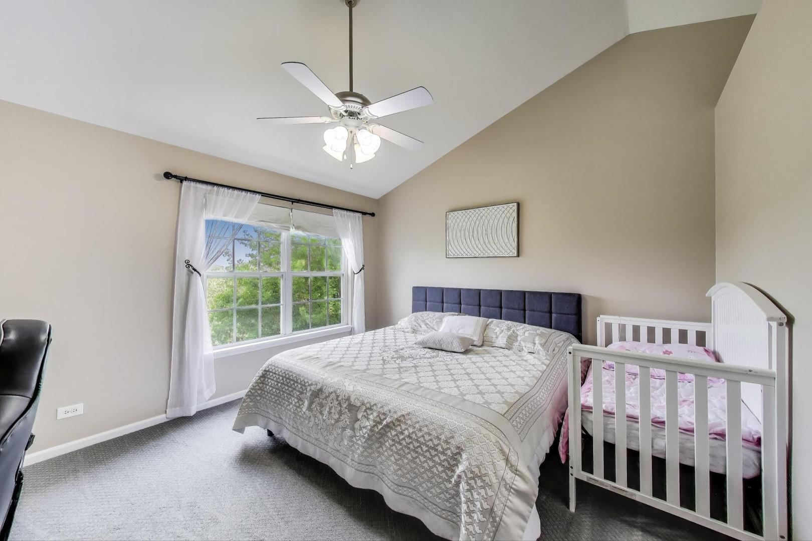 532 Declaration Lane Aurora, IL 60502 - Photo 13 of 34 a bedroom with a bed and a window