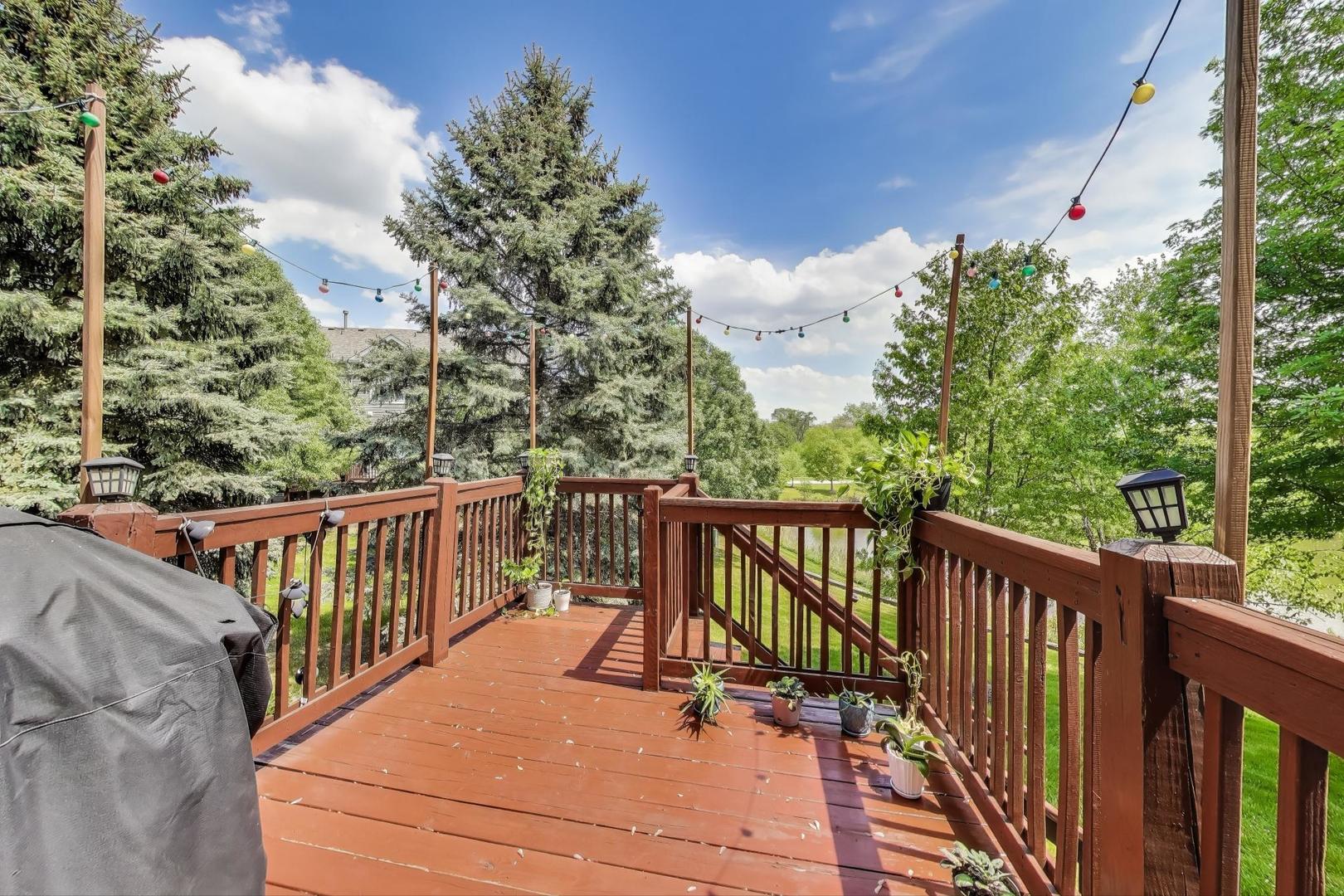 532 Declaration Lane Aurora, IL 60502 - Photo 25 of 34 a view of balcony with wooden floor and fence