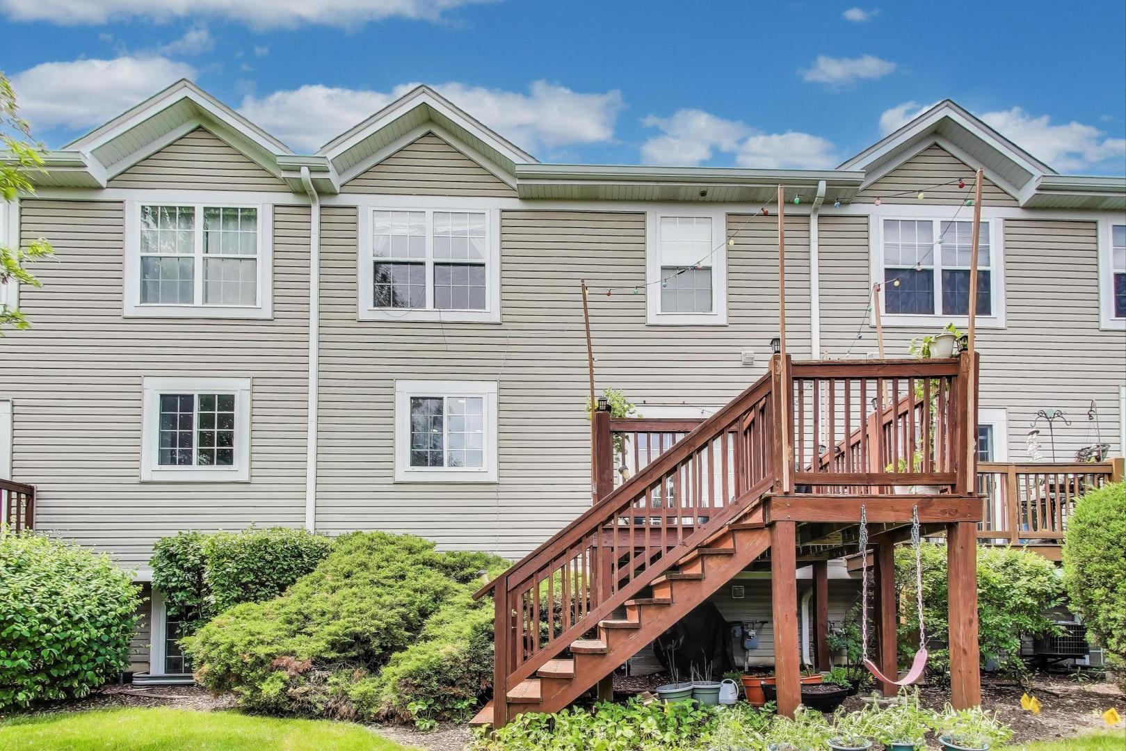 532 Declaration Lane Aurora, IL 60502 - Photo 27 of 34 a front view of a house with wooden stairs