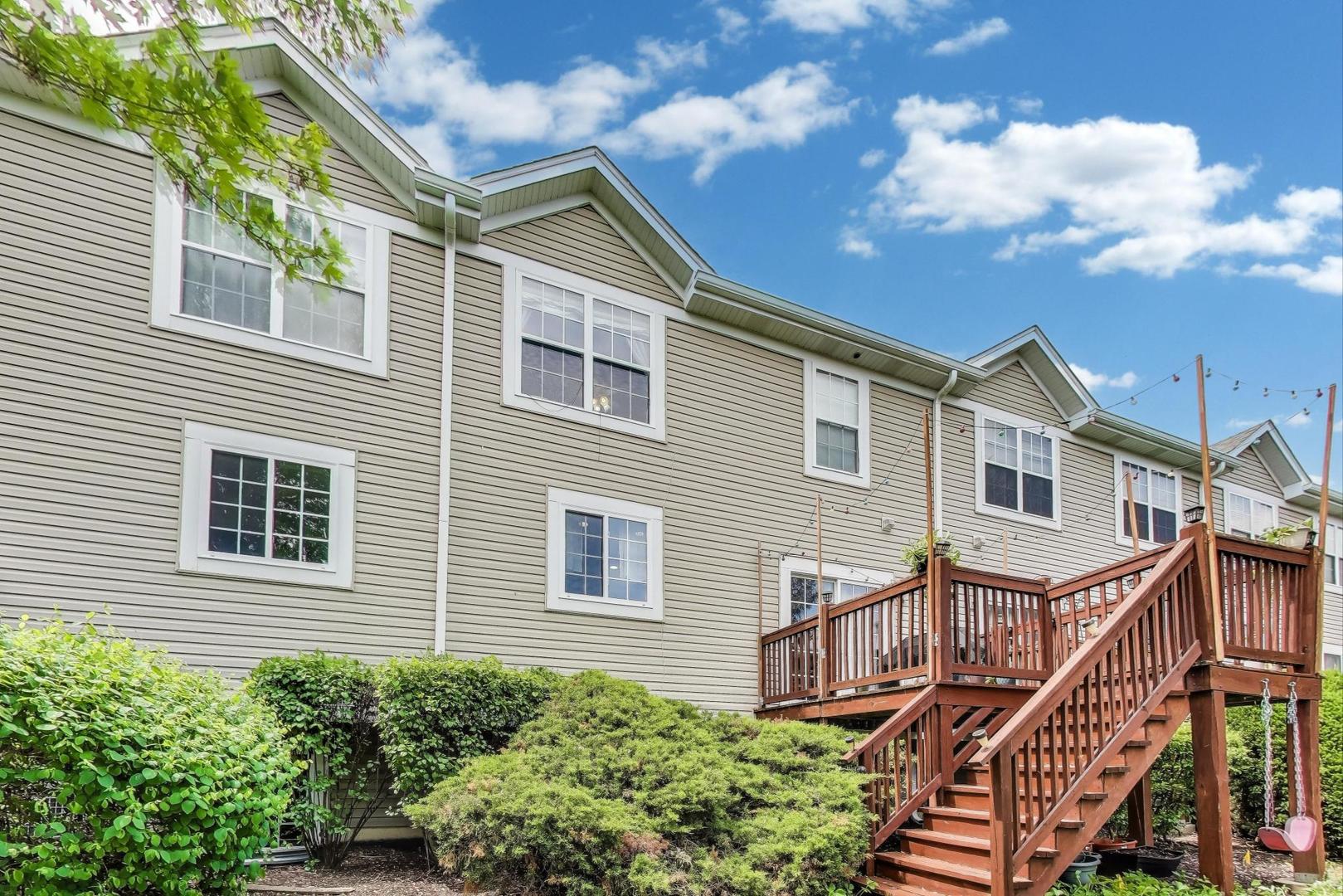 532 Declaration Lane Aurora, IL 60502 - Photo 28 of 34 a view of a house with wooden deck front of house