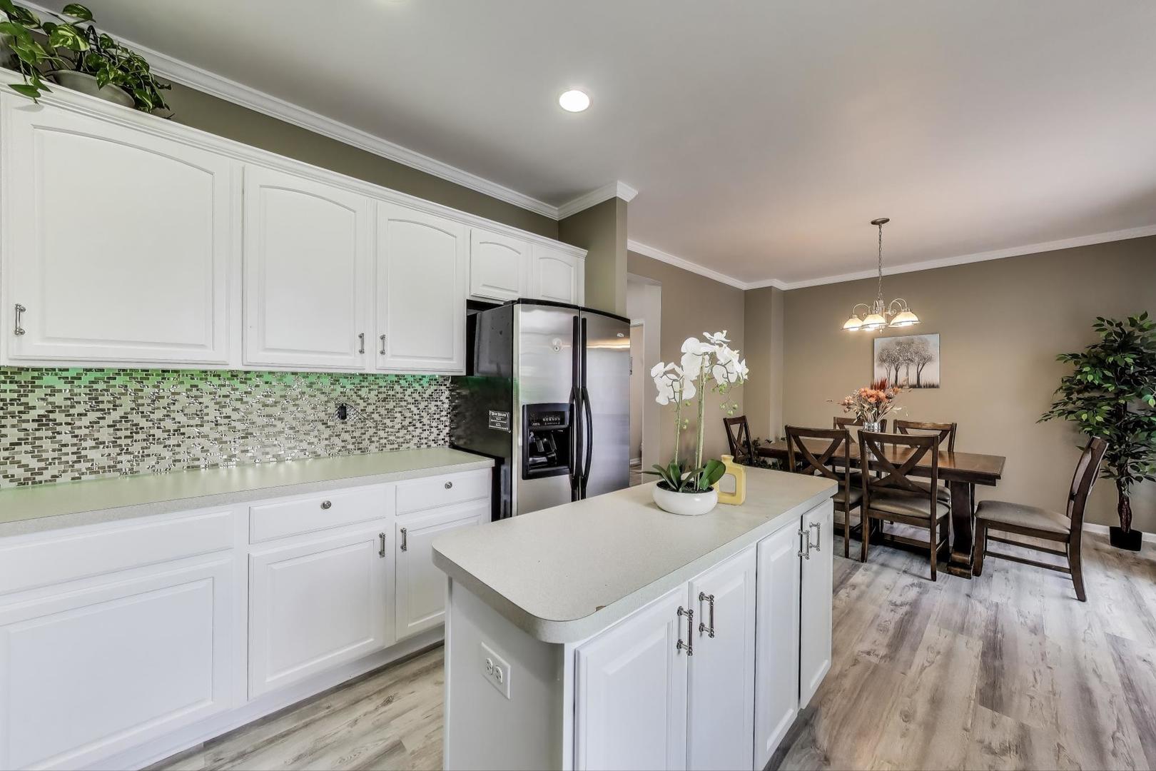 532 Declaration Lane Aurora, IL 60502 - Photo 10 of 34 a kitchen with a sink refrigerator and cabinets