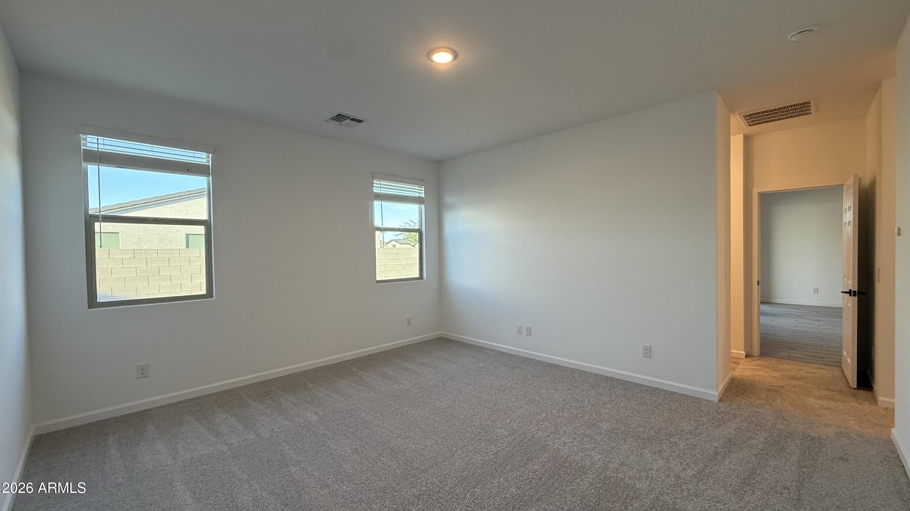 46818 West Old Timer Road Maricopa, AZ 85139 - Photo 20 of 34 a view of an empty room with a window