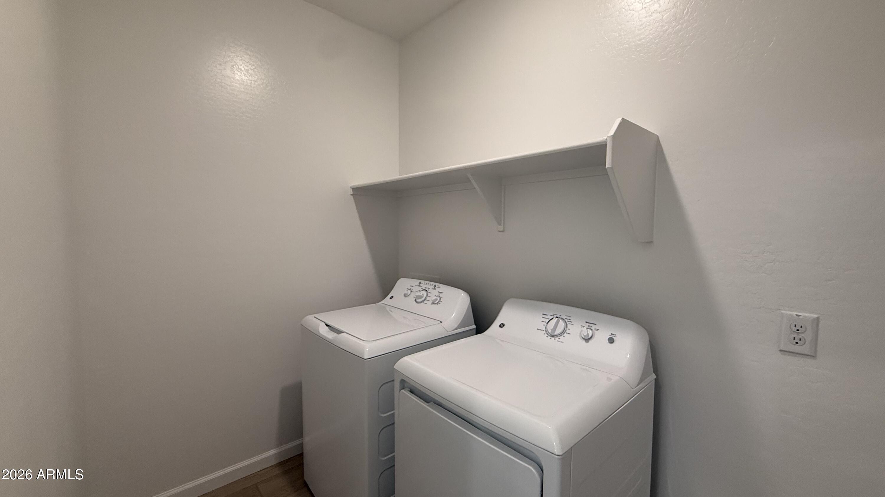 46818 West Old Timer Road Maricopa, AZ 85139 - Photo 21 of 34 a utility room with dryer and washer
