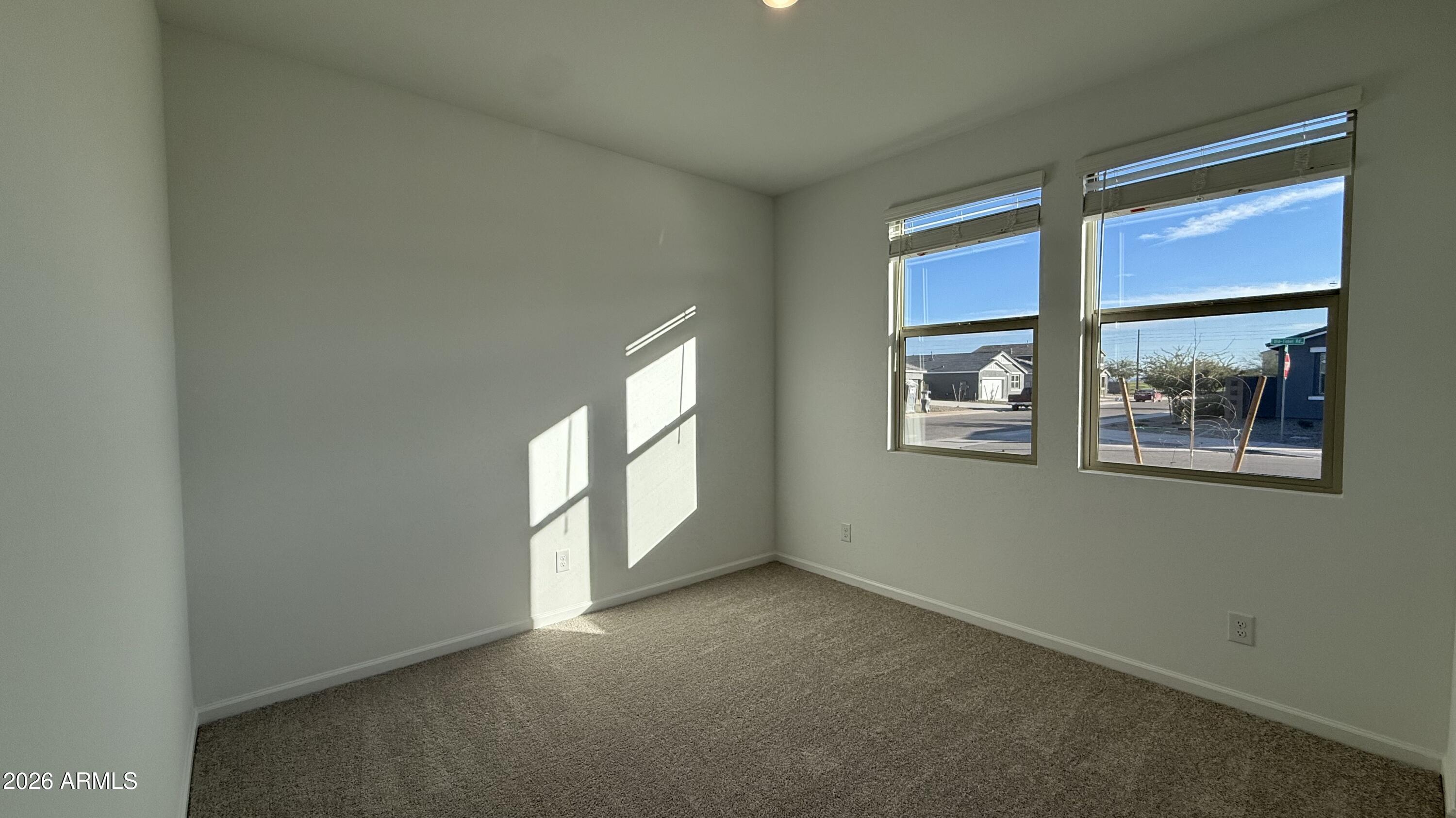 46818 West Old Timer Road Maricopa, AZ 85139 - Photo 6 of 34 an empty room with windows