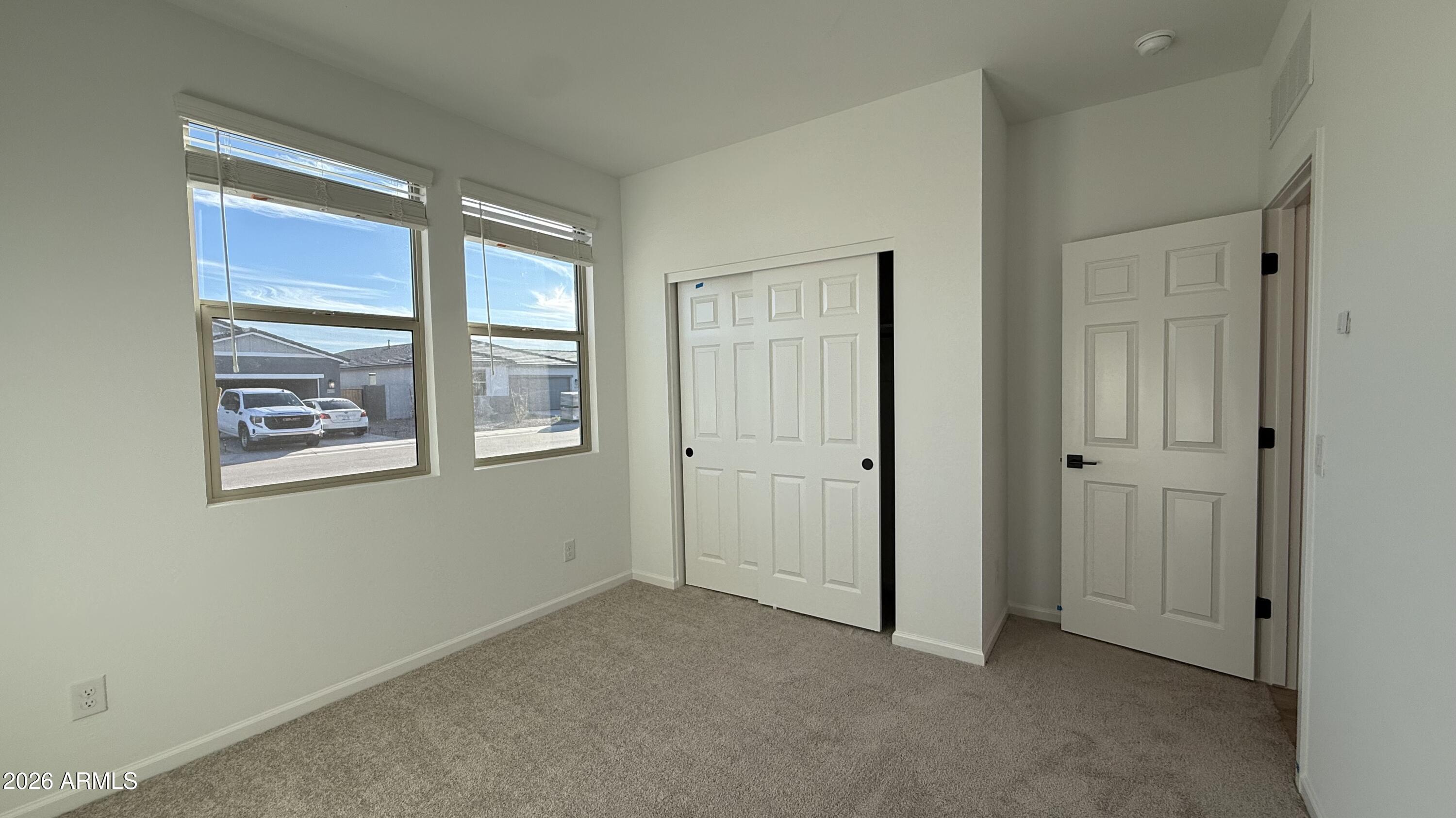 46818 West Old Timer Road Maricopa, AZ 85139 - Photo 7 of 34 a view of an empty room with a window