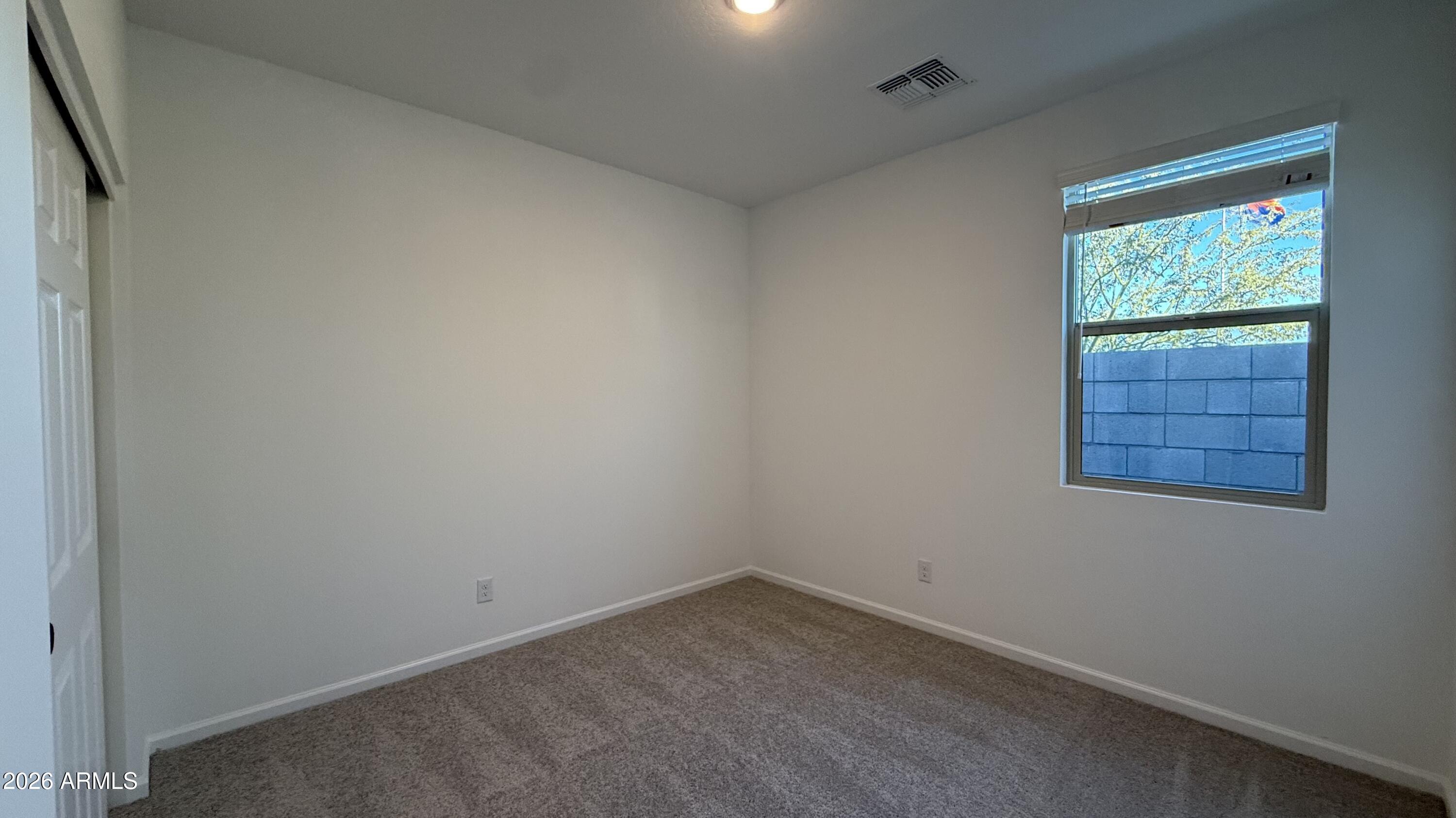 46818 West Old Timer Road Maricopa, AZ 85139 - Photo 9 of 34 an empty room with a window