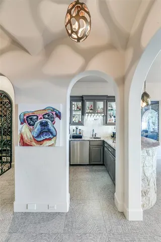 a room with furniture pool table gym equipment wooden floor and windows