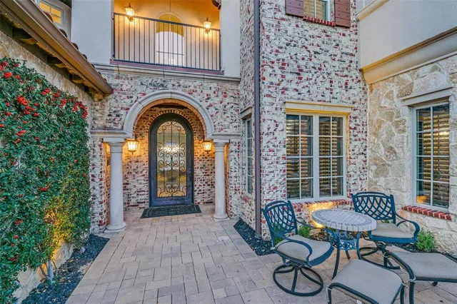 a front view of a house with outdoor seating