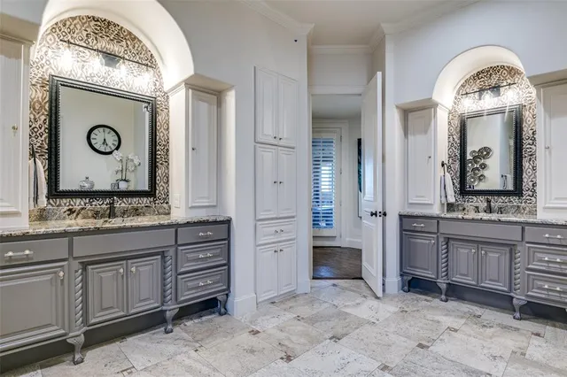 a bathroom with a granite countertop toilet a sink and a bathtub