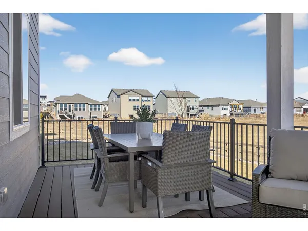 a view of a balcony with furniture
