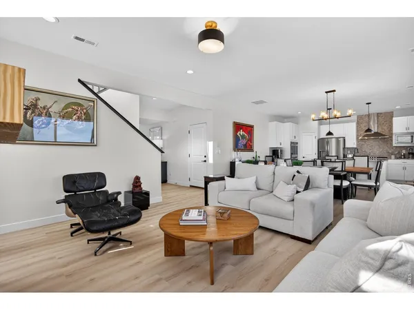 a living room with furniture and a rug