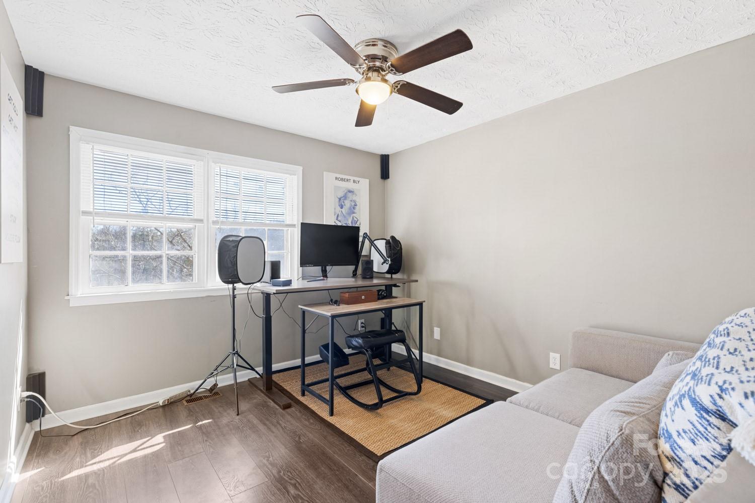 39 Edwards Road Fairview, NC 28730 - Photo 11 of 20 a view of a workspace with furniture and a window