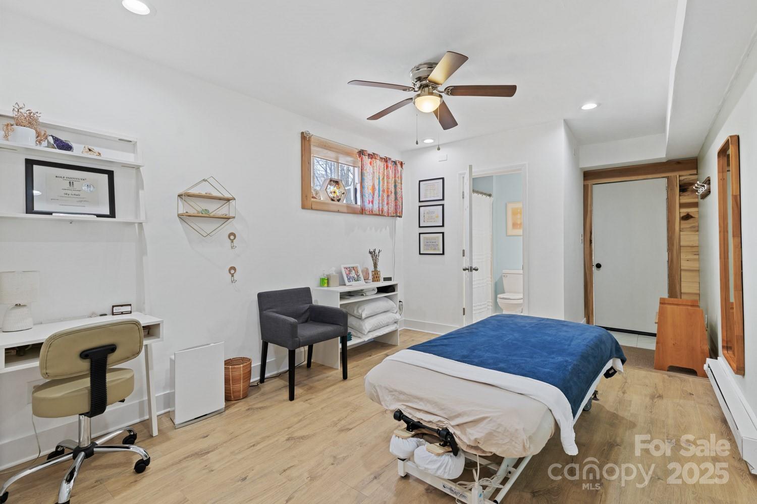 39 Edwards Road Fairview, NC 28730 - Photo 13 of 20 a bedroom with a bed and a desk