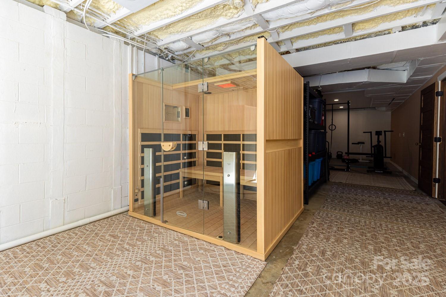 39 Edwards Road Fairview, NC 28730 - Photo 16 of 20 a view of walk in closet with wooden floor