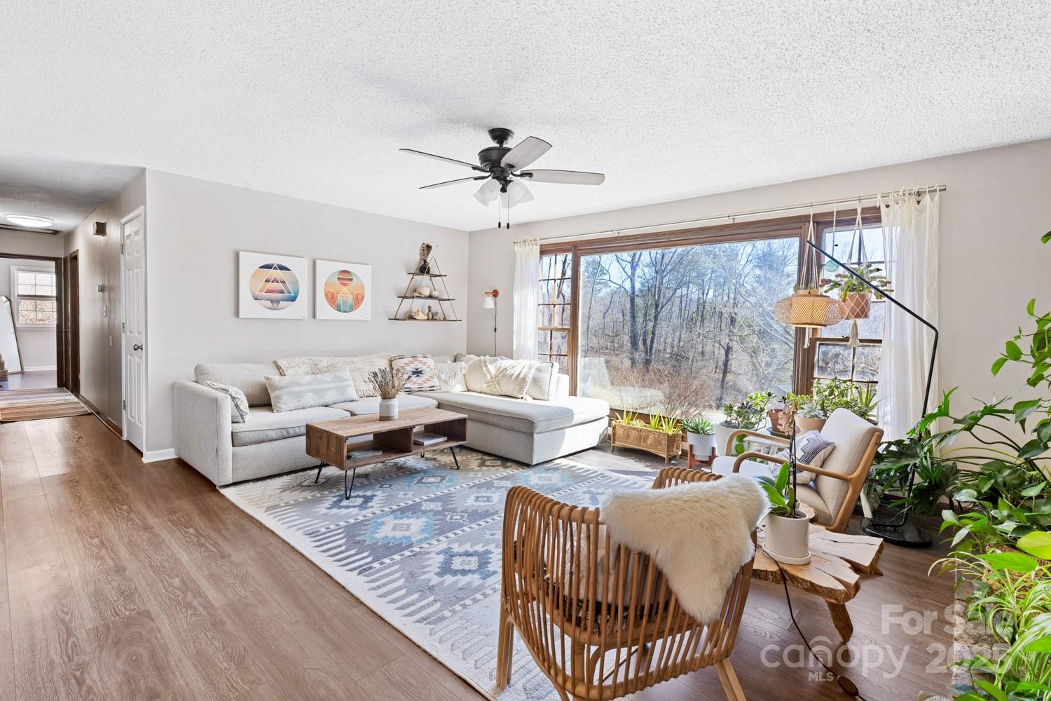 39 Edwards Road Fairview, NC 28730 - Photo 8 of 20 a living room with furniture and a large window
