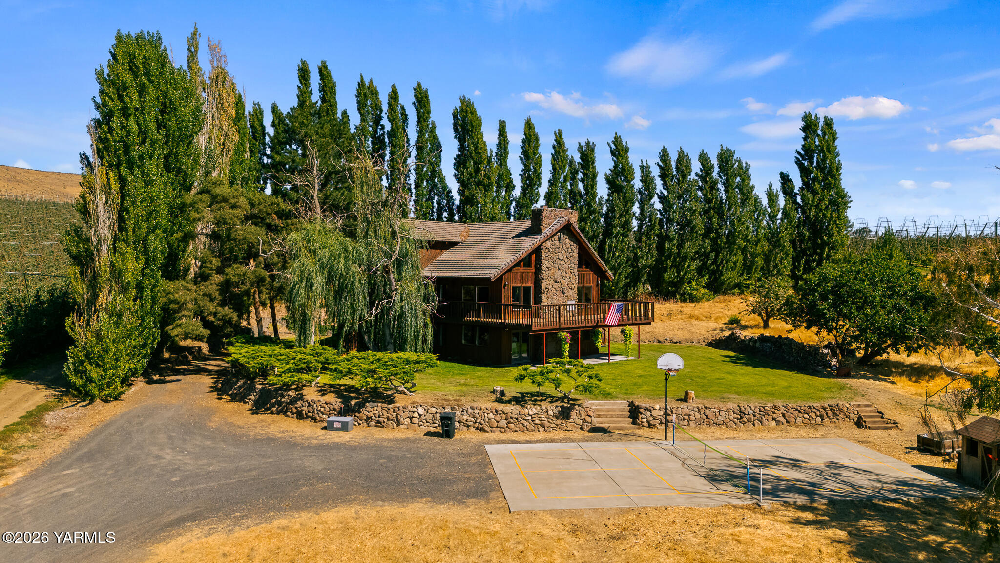 13619 Summitview Ext Road Yakima, WA 98908 - Photo 5 of 56 a view of a house with palm trees and a small yard