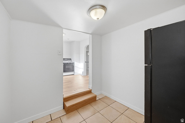 708 9th Street Ogden, UT 84404 - Photo 11 of 17 Hall with arched walkways and light tile patterned floors
