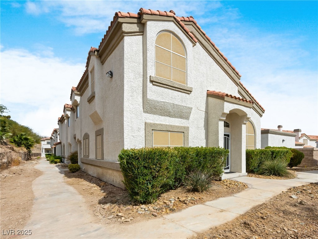353 Seine Way, Unit N Henderson, NV 89014 - Photo 2 of 36 (TO THE LEFT LOOKS MESSY BUT A WALL HAS BEEN PUT UP AND LANDSCAPING DONE)